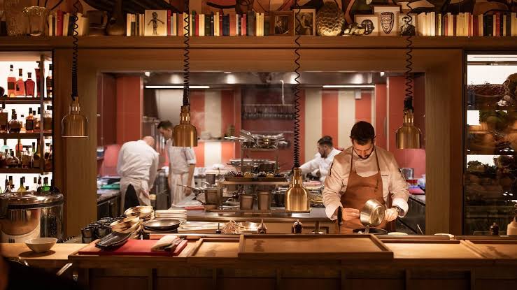 Employees working in a restaurant kitchen