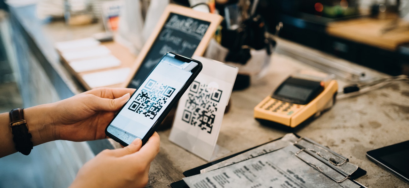 What are the benefits of QR code menus at restaurants?