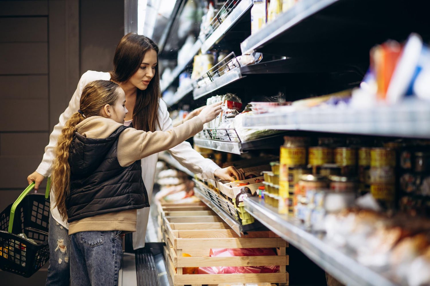 mother and daughter shopping in a supermarket