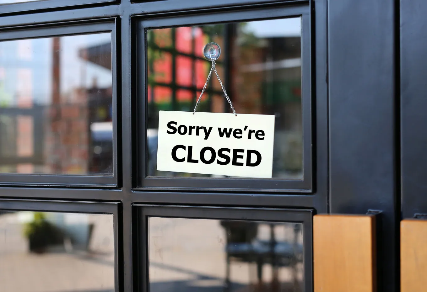 a restaurant sign showing that the restaurant is shutting down