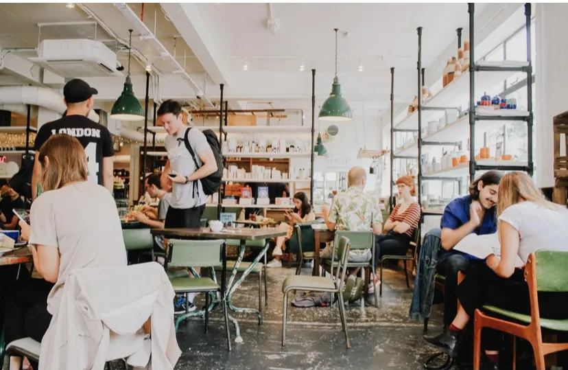 Employees at a restaurant working and serving guests