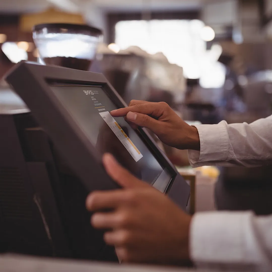 A waiter working on the restaurant management system 