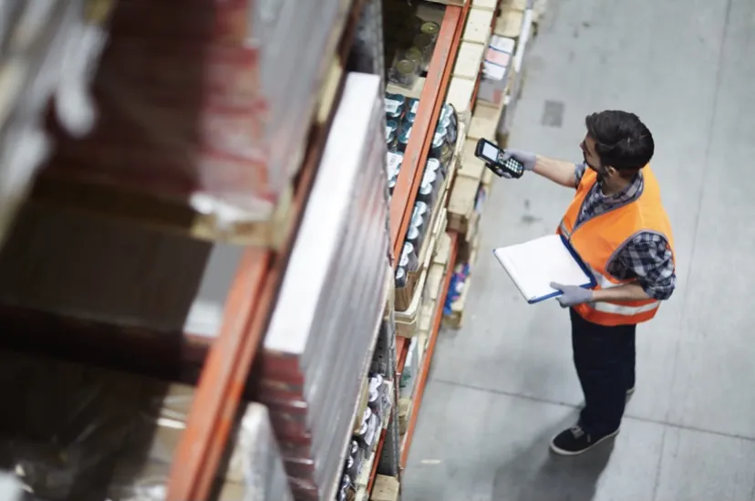 Employee managing stock in warehouse 