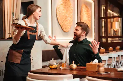 Customer is angry at the waiter in a restaurant