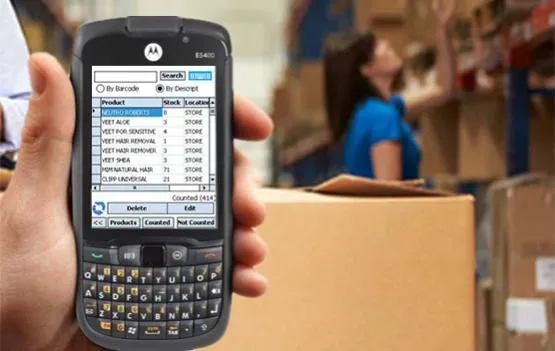 an employee checking inventory to identify purchases needed