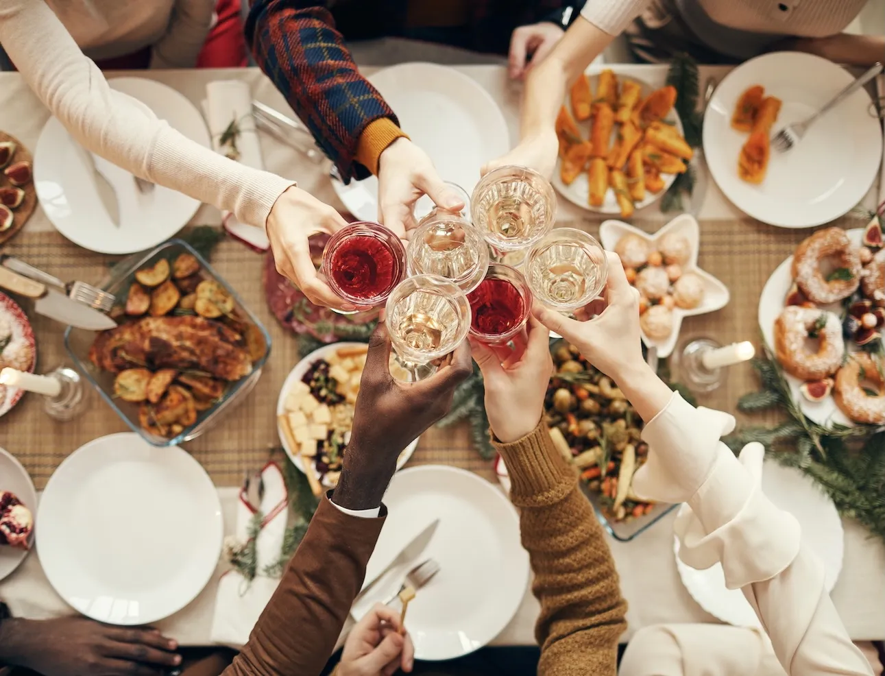 Customers enjoying Christmas dinner and drinks at a restaurant 