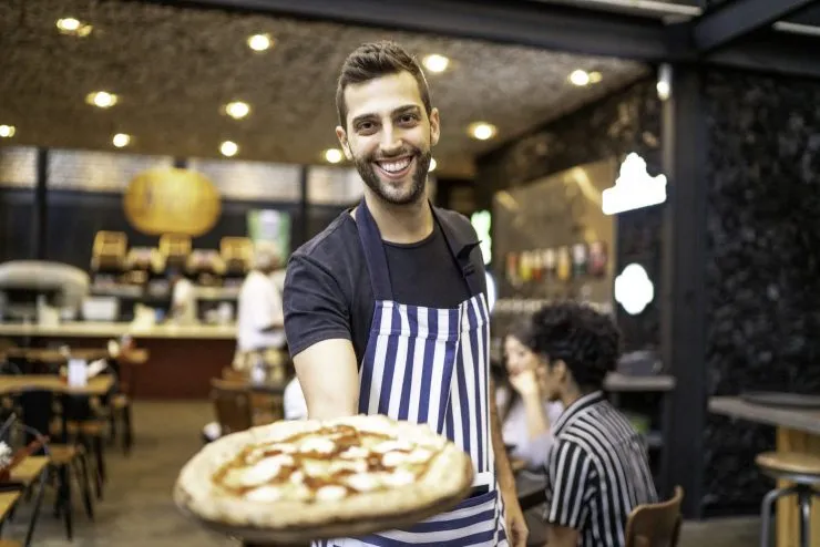 A happy employee working at restaurants