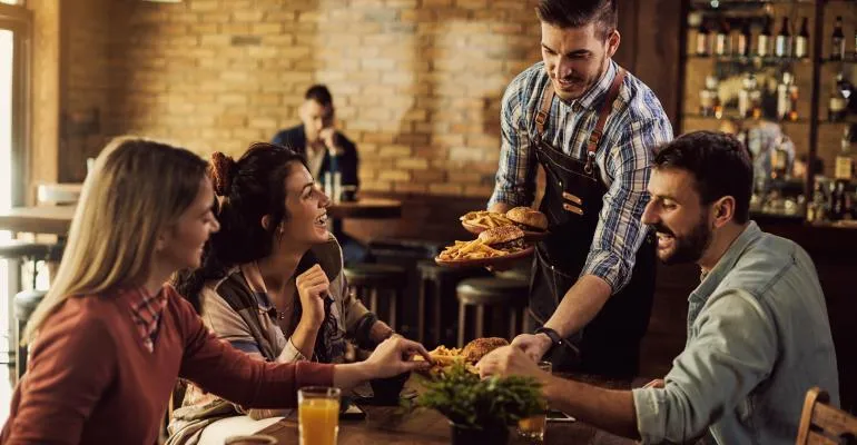 happy customers sitting at a restaurant