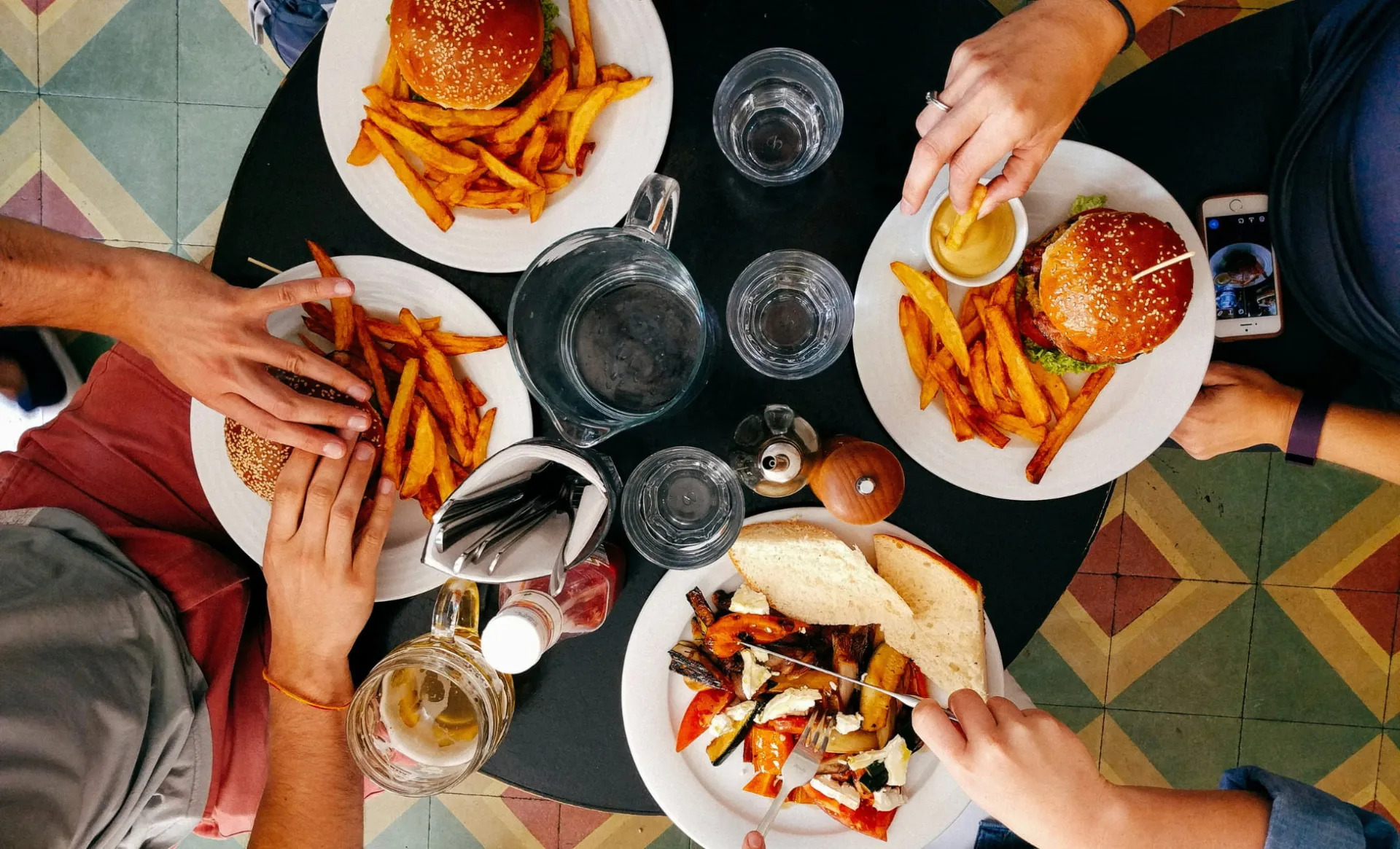 Customers sharing food at a restaurant 