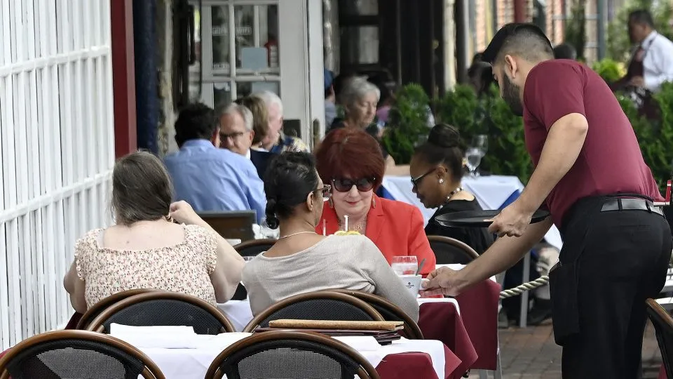 Restaurant sales: a waiter serving customers