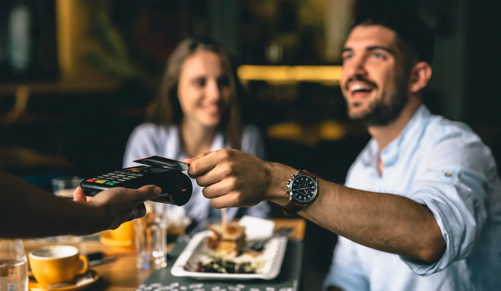 customers paying at the restaurant with the card