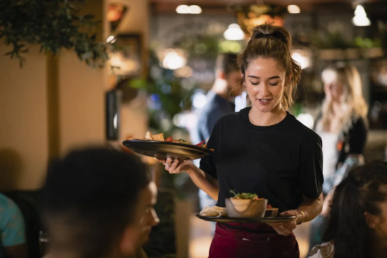 a waitress serving customers 