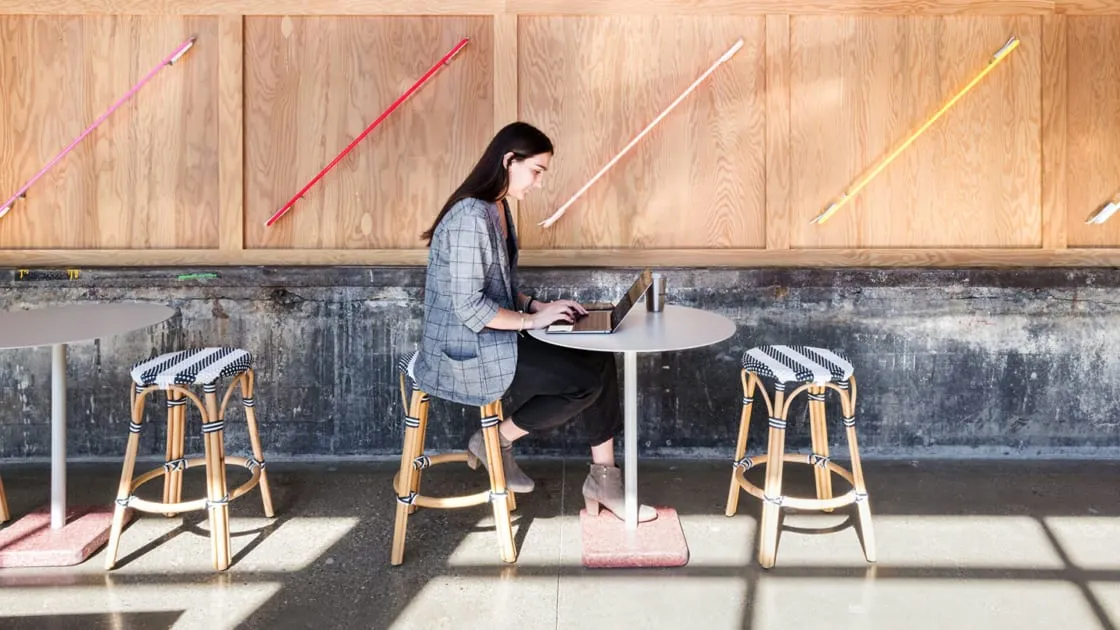 An employee working remotely from a restaurant