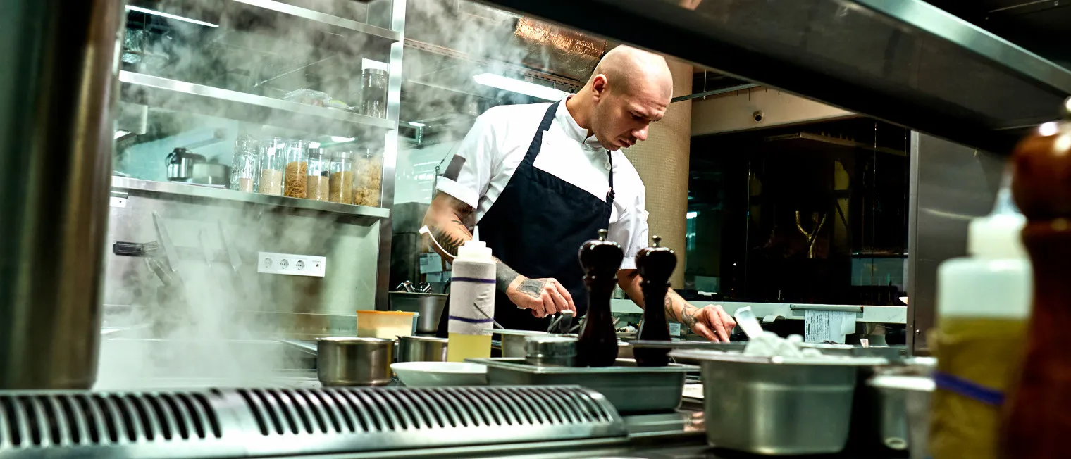 A chef preparing food at a restaurant