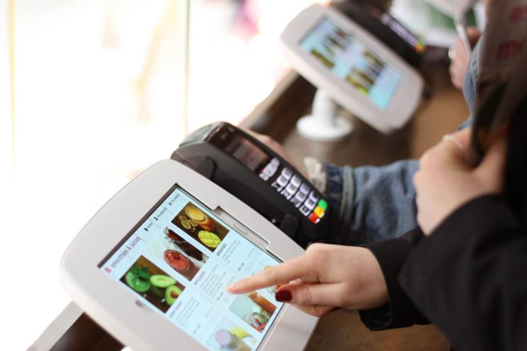 processing orders at a restaurant on a self-ordering kiosk