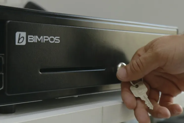 An employee stealing from the cash drawer