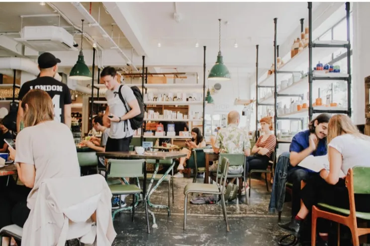 Employees at a restaurant working and serving guests