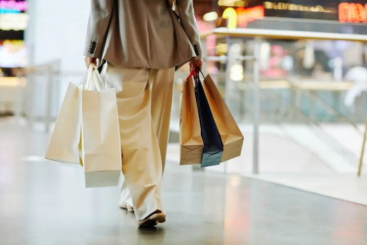 a customer holding shopping bags