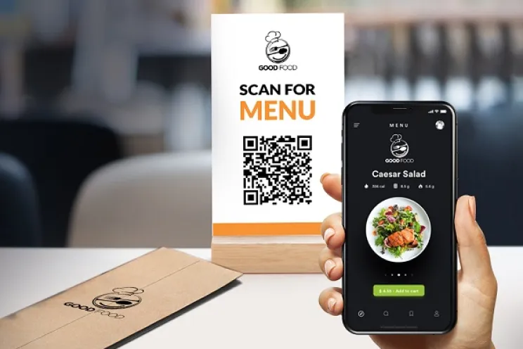 A customer scanning the QR code to explore the restaurant's digital menu