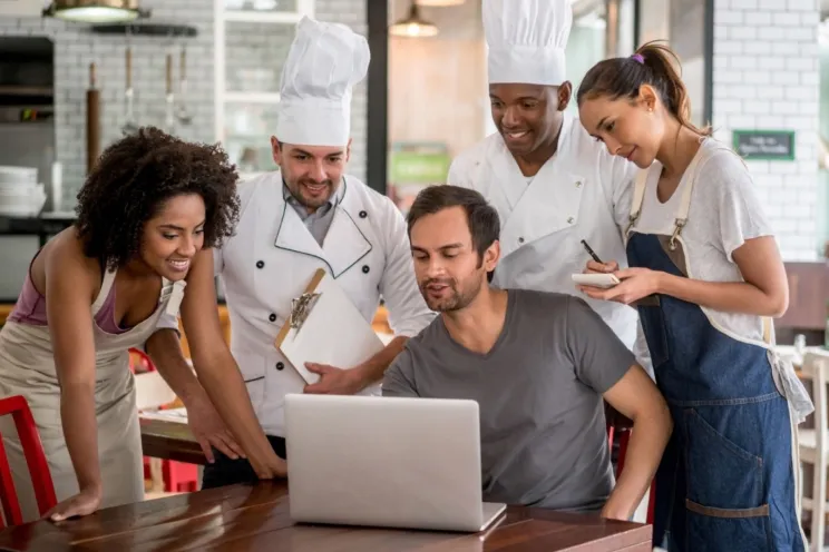 A meeting with a restaurant manager and his staff
