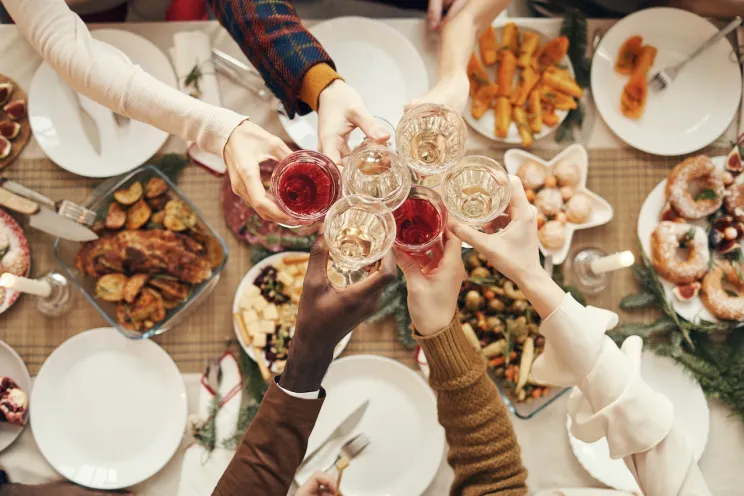 Customers enjoying Christmas dinner and drinks at a restaurant 