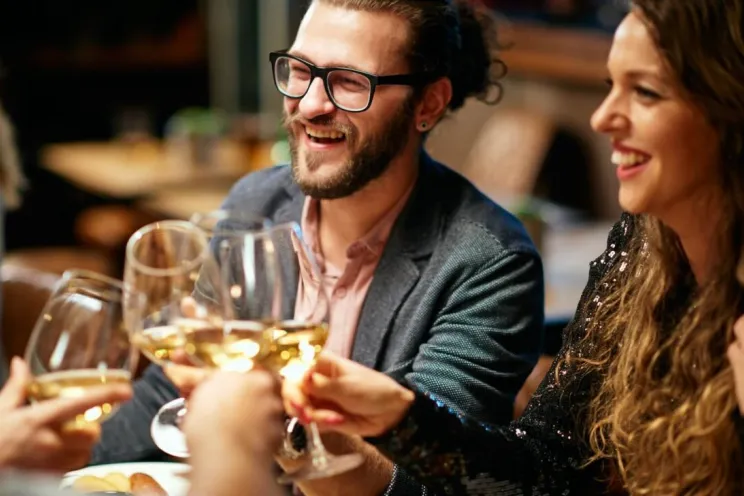 group of friends enjoying dinner at a restaurant