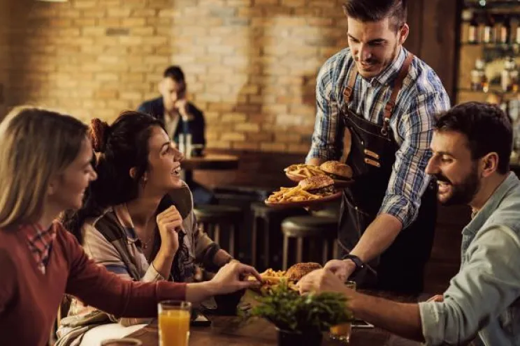 happy customers sitting at a restaurant