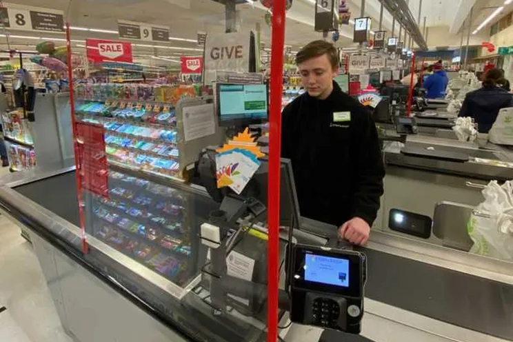 An employee working in a supermarket
