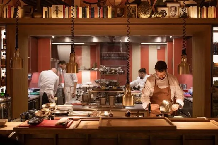 Employees working in a restaurant kitchen