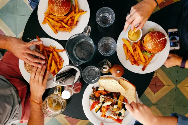 Customers sharing food at a restaurant 