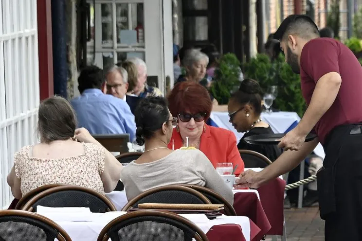 Restaurant sales: a waiter serving customers