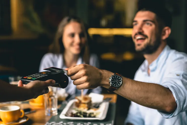 customers paying at the restaurant with the card