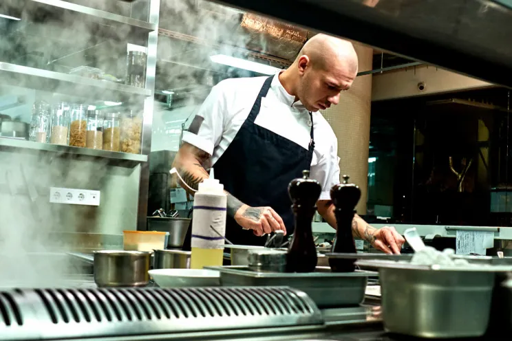A chef preparing food at a restaurant